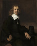En ung mand sidder ved et bord, måske Govaert Flinck - Rembrandt van Rijn — visning af kunstværket