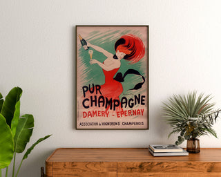 Vintage-reklameplakat Champagne Damery-Épernay, indrammet over en trækommode mellem planter.