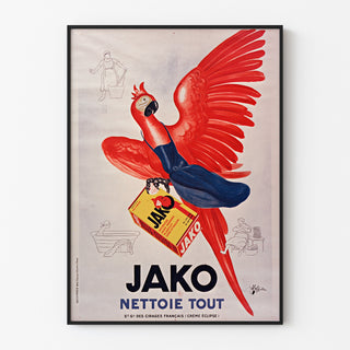 Vintage-reklameplakat Jako nettoie tout, vist i en tynd ramme på en lys væg.