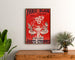 Vintage reklameplakat Paris‑Dijon, legetøj og nytårsgaver, indrammet over en trækommode mellem planter.