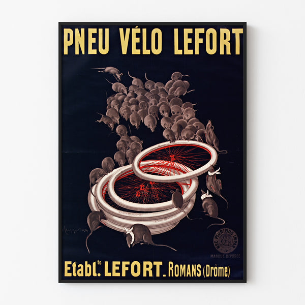 Vintage plakat Pneus vélo Lefort, vist i en slank ramme på en lys væg.