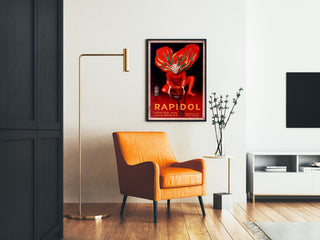 Vintage plakat Rapidol, indrammet i et opholdsstue med en orange lænestol og en gulvlampe.