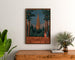 Vintage-plakat Thann, industriel udstilling, indrammet over en trækommode mellem planter.