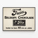Vintage plakat Freia Selskabs Chokolade vægdekoration — indrammet kunstværk på væggen